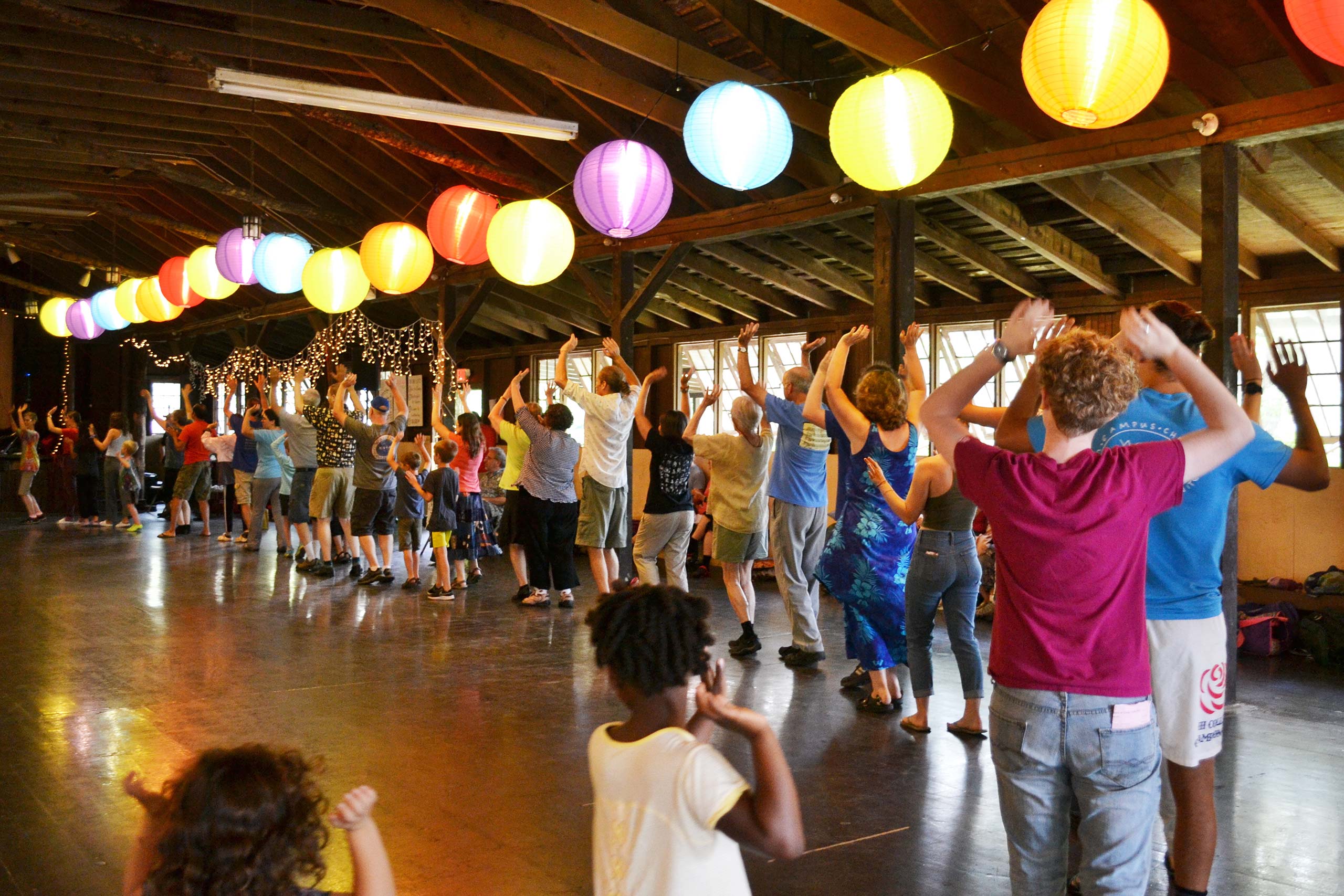 Dancing under brightly colored lanterns at Cascade of Music and Dance