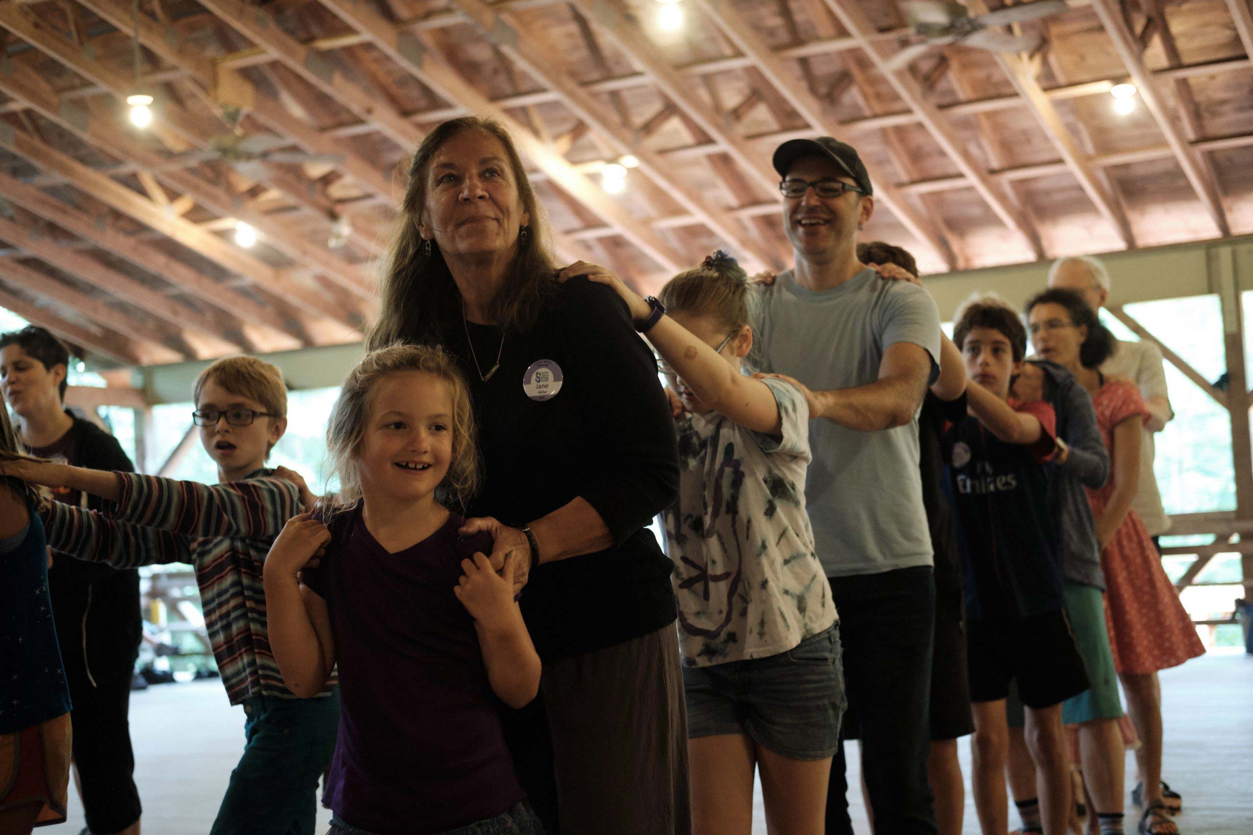 An intergenerational line of dancers