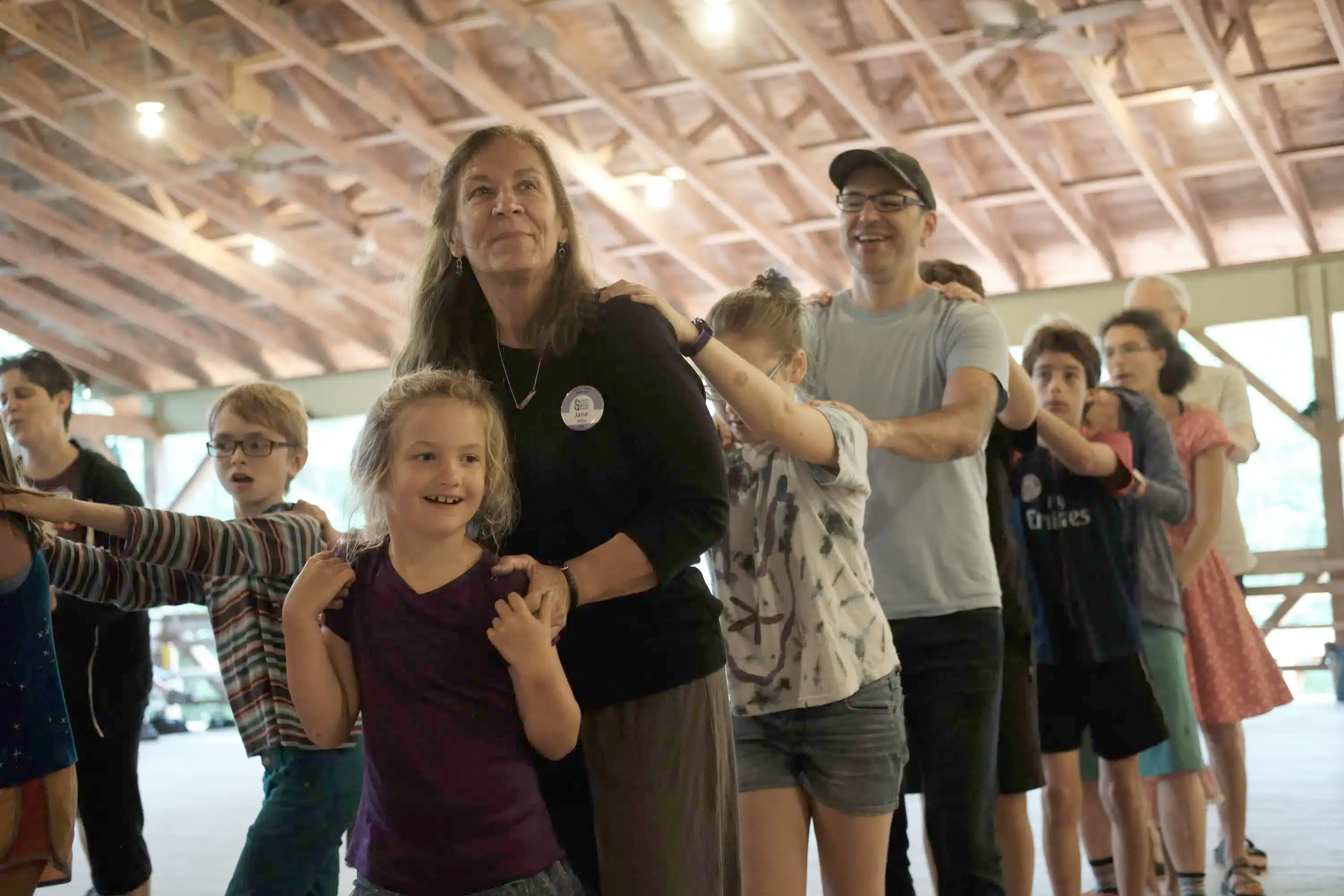 An intergenerational line of dancers
